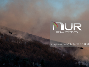 Army National Guard Blackhawk helicopters use water from Greenwood Lake to fight the Jennings Creek Wildfire in Greenwood Lake, NY, U.S., on...