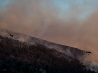 Army National Guard Blackhawk helicopters use water from Greenwood Lake to fight the Jennings Creek Wildfire in Greenwood Lake, NY, U.S., on...