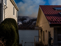 The Jennings Creek Wildfire burns near Greenwood Lake, NY, U.S., on November 13, 2024. The fire burns roughly 5000 acres with fire crews and...