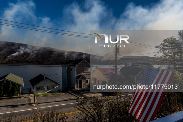 The Jennings Creek Wildfire burns near Greenwood Lake, NY, U.S., on November 13, 2024. The fire burns roughly 5000 acres with fire crews and...