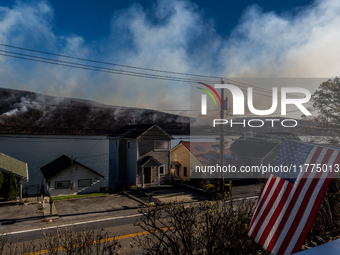 The Jennings Creek Wildfire burns near Greenwood Lake, NY, U.S., on November 13, 2024. The fire burns roughly 5000 acres with fire crews and...