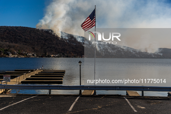 The Jennings Creek Wildfire burns near Greenwood Lake, NY, U.S., on November 13, 2024. The fire burns roughly 5000 acres with fire crews and...