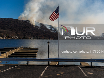 The Jennings Creek Wildfire burns near Greenwood Lake, NY, U.S., on November 13, 2024. The fire burns roughly 5000 acres with fire crews and...