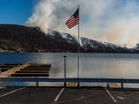 The Jennings Creek Wildfire burns near Greenwood Lake, NY, U.S., on November 13, 2024. The fire burns roughly 5000 acres with fire crews and...