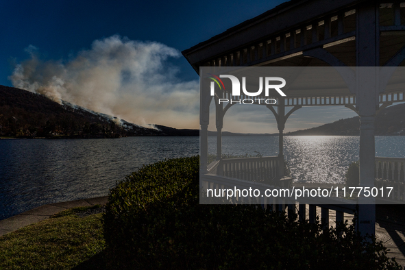 The Jennings Creek Wildfire burns near Greenwood Lake, NY, U.S., on November 13, 2024. The fire burns roughly 5000 acres with fire crews and...