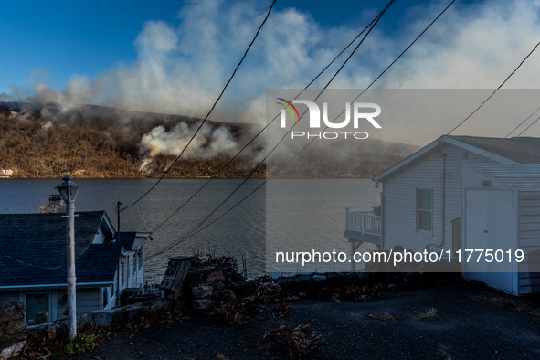 The Jennings Creek Wildfire burns near Greenwood Lake, NY, U.S., on November 13, 2024. The fire burns roughly 5000 acres with fire crews and...