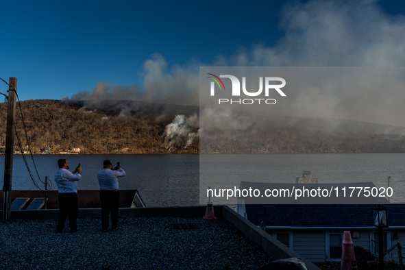 The Jennings Creek Wildfire burns near Greenwood Lake, NY, U.S., on November 13, 2024. The fire burns roughly 5000 acres with fire crews and...