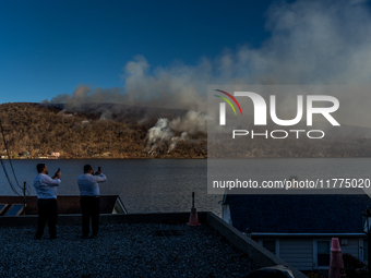 The Jennings Creek Wildfire burns near Greenwood Lake, NY, U.S., on November 13, 2024. The fire burns roughly 5000 acres with fire crews and...