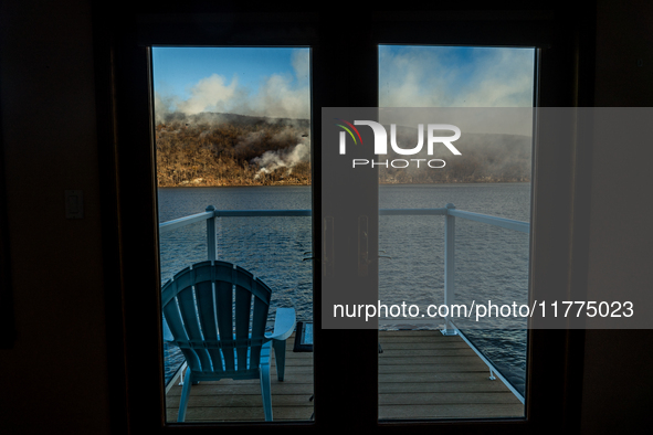 The Jennings Creek Wildfire is seen from a home in Greenwood Lake, NY, U.S., on November 13, 2024. The fire burns roughly 5000 acres with fi...