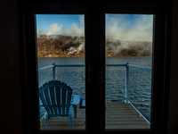 The Jennings Creek Wildfire is seen from a home in Greenwood Lake, NY, U.S., on November 13, 2024. The fire burns roughly 5000 acres with fi...