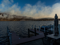 The Jennings Creek Wildfire is seen from a home in Greenwood Lake, NY, U.S., on November 13, 2024. The fire burns roughly 5000 acres with fi...