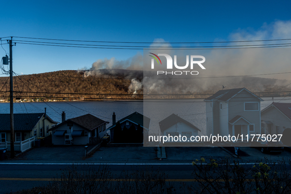 The Jennings Creek Wildfire burns near Greenwood Lake, NY, U.S., on November 13, 2024. The fire burns roughly 5000 acres with fire crews and...