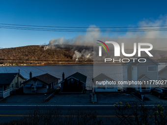 The Jennings Creek Wildfire burns near Greenwood Lake, NY, U.S., on November 13, 2024. The fire burns roughly 5000 acres with fire crews and...