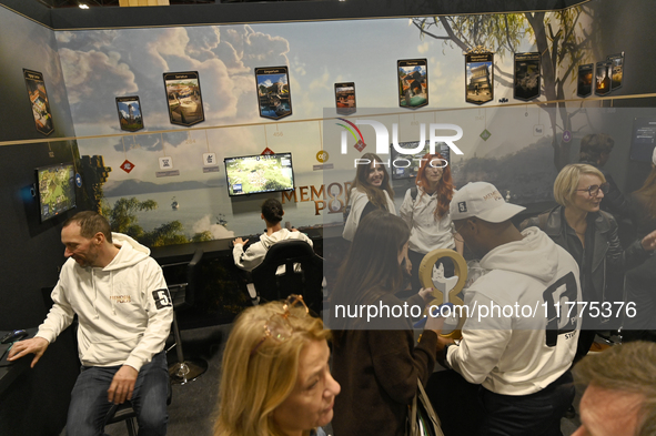 Visitors and gamers play the city-building game ''Memoria Polis,'' developed by 5PM Studio, at the ''Paris Games Week'' video-game fair in P...