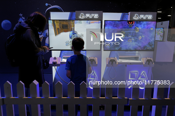 A young gamer plays the game ''Astro Bot'' on PS5 at the ''Paris Games Week'' video-game fair in Paris, France, on October 22, 2024. 