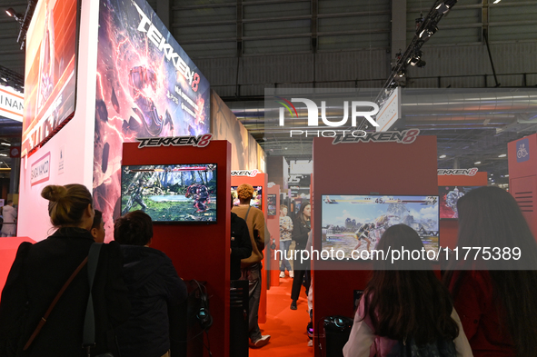 Visitors and gamers play the game ''Tekken 8'' at the Bandai Namco stand during the ''Paris Games Week'' video-game fair in Paris, France, o...