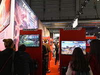 Visitors and gamers play the game ''Tekken 8'' at the Bandai Namco stand during the ''Paris Games Week'' video-game fair in Paris, France, o...