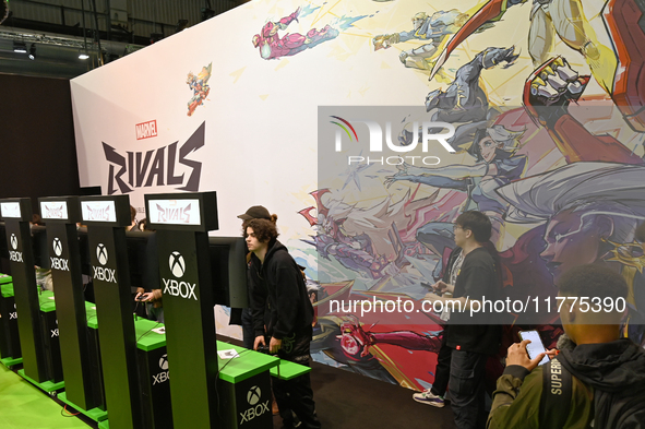 Visitors and gamers play the game ''RIVALS'' at the MARVEL stand during the ''Paris Games Week'' video-game fair in Paris, France, on Octobe...