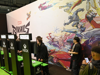 Visitors and gamers play the game ''RIVALS'' at the MARVEL stand during the ''Paris Games Week'' video-game fair in Paris, France, on Octobe...