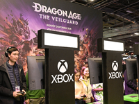 Visitors and gamers play the game ''Dragon Age The Veilguard'' at the ''Paris Games Week'' video-game fair in Paris, France, on October 22,...