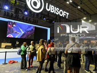 Visitors and gamers wait in front of the stand of the brand ''UBISOFT'' at the ''Paris Games Week'' video-game fair in Paris, France, on Oct...