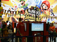 Visitors and gamers play the game ''SUPER MARIO'' at the Nintendo stand during the ''Paris Games Week'' video-game fair in Paris, France, on...