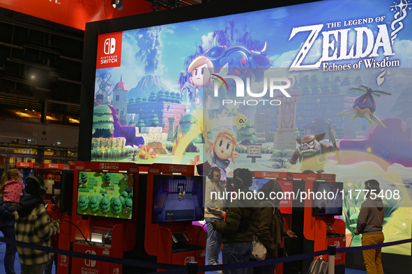 Visitors and gamers play the game ''The Legend of ZELDA'' at the Nintendo stand at the ''Paris Games Week'' video-game fair in Paris, France...