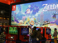 Visitors and gamers play the game ''The Legend of ZELDA'' at the Nintendo stand at the ''Paris Games Week'' video-game fair in Paris, France...