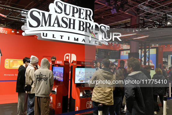 Visitors and gamers play the game ''Super Smash Bros'' at the Nintendo stand at the ''Paris Games Week'' video-game fair in Paris, France, o...