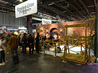 Visitors and gamers stand in front of the ''Kingdom Come: Deliverance'' stand, developed by Warhorse Studios, at the ''Paris Games Week'' vi...