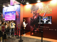 Visitors and gamers wait to play the game ''Pirate Yakuza in Hawaii,'' edited by Sega, at the ''Paris Games Week'' video-game fair in Paris,...