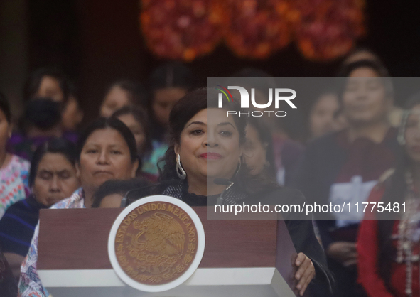 Clara Brugada, head of government of Mexico City, accompanies Claudia Sheinbaum (white jacket), president of Mexico, at the National Palace...