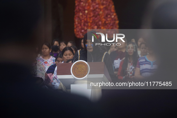 Indigenous women artisans accompany Claudia Sheinbaum (white jacket), President of Mexico, at the National Palace in Mexico City, Mexico, du...