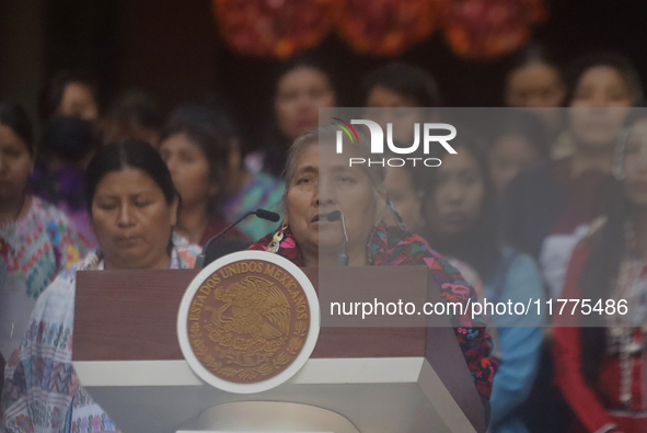 Indigenous women artisans accompany Claudia Sheinbaum (white jacket), President of Mexico, at the National Palace in Mexico City, Mexico, du...