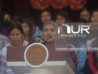 Indigenous women artisans accompany Claudia Sheinbaum (white jacket), President of Mexico, at the National Palace in Mexico City, Mexico, du...