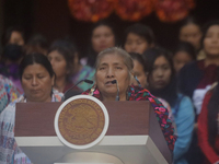 Indigenous women artisans accompany Claudia Sheinbaum (white jacket), President of Mexico, at the National Palace in Mexico City, Mexico, du...