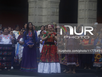 Indigenous women artisans accompany Claudia Sheinbaum (white jacket), President of Mexico, at the National Palace in Mexico City, Mexico, du...