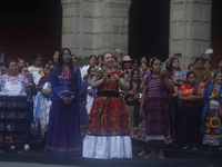 Indigenous women artisans accompany Claudia Sheinbaum (white jacket), President of Mexico, at the National Palace in Mexico City, Mexico, du...