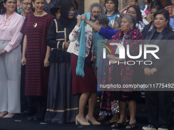 Claudia Sheinbaum (white jacket), President of Mexico, is at the National Palace in Mexico City, Mexico, during the announcement of the next...