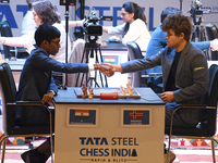 Norway's five-time world chess champion Magnus Carlsen (right) and Indian R Praggnanandhaa participate on the first day of the 6th Tata Stee...