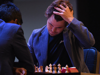 Norway's five-time world chess champion Magnus Carlsen (right) and Indian R Praggnanandhaa participate on the first day of the 6th Tata Stee...