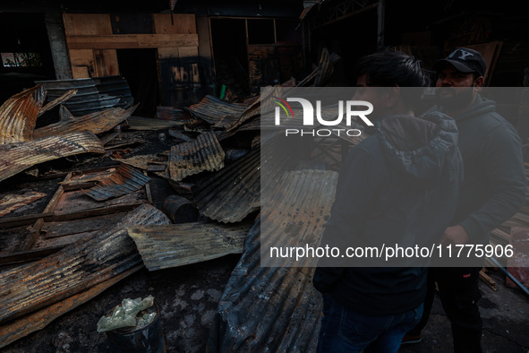 Residents and authorities survey the aftermath of a massive fire that ravages multiple factories in Sopore's Industrial Estate, Jammu and Ka...