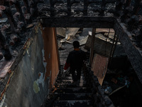 Residents and authorities survey the aftermath of a massive fire that ravages multiple factories in Sopore's Industrial Estate, Jammu and Ka...