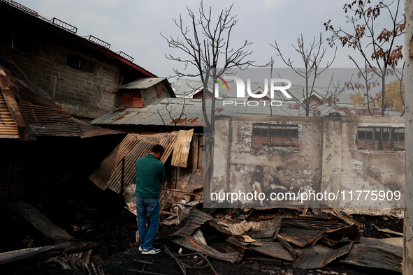 Residents and authorities survey the aftermath of a massive fire that ravages multiple factories in Sopore's Industrial Estate, Jammu and Ka...