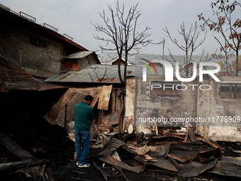 Residents and authorities survey the aftermath of a massive fire that ravages multiple factories in Sopore's Industrial Estate, Jammu and Ka...