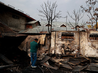 Residents and authorities survey the aftermath of a massive fire that ravages multiple factories in Sopore's Industrial Estate, Jammu and Ka...