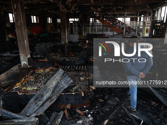 Residents and authorities survey the aftermath of a massive fire that ravages multiple furniture factories in Sopore's Industrial Estate, Ja...