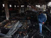 Residents and authorities survey the aftermath of a massive fire that ravages multiple furniture factories in Sopore's Industrial Estate, Ja...