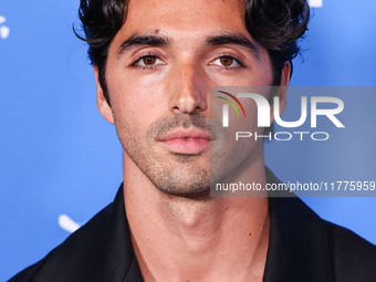 Taylor Zakhar Perez arrives at the Los Angeles Premiere Of A24's 'Queer' held at the Directors Guild of America Theater Complex on November...