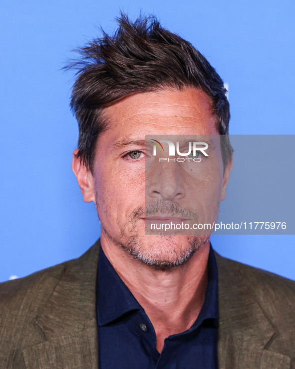 Simon Rex arrives at the Los Angeles Premiere Of A24's 'Queer' held at the Directors Guild of America Theater Complex on November 13, 2024 i...